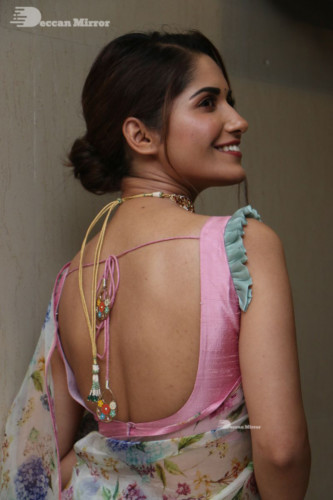 Telugu Actress Ruhani Sharma in a white and pink saree
