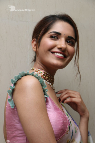 Telugu Actress Ruhani Sharma in a white and pink saree