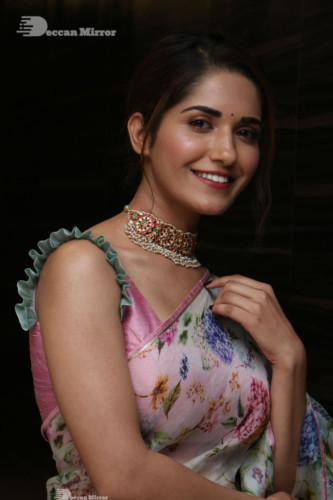 Telugu Actress Ruhani Sharma in a white and pink saree