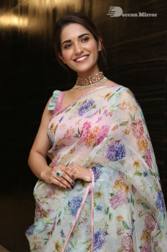 Telugu Actress Ruhani Sharma in a white and pink saree