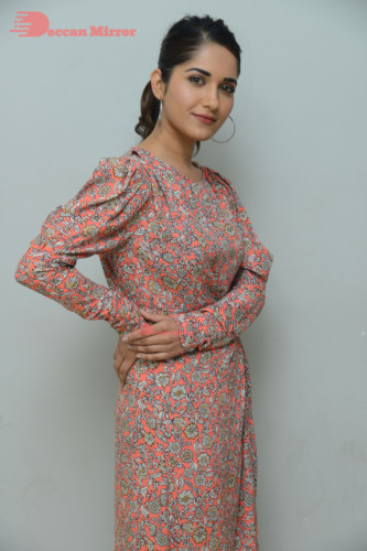 Telugu Actress Ruhani Sharma photoshoot in a orange dress