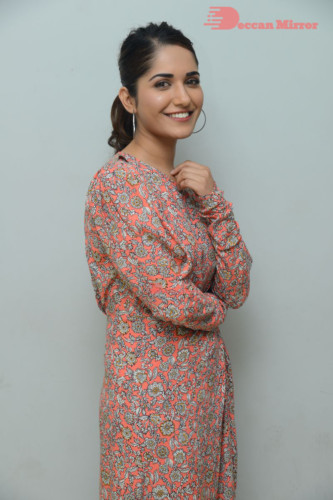 Telugu Actress Ruhani Sharma photoshoot in a orange dress