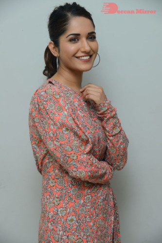 Telugu Actress Ruhani Sharma photoshoot in a orange dress