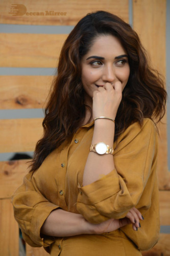 Telugu Actress Ruhani Sharma Photoshoot in a dark yellow dress