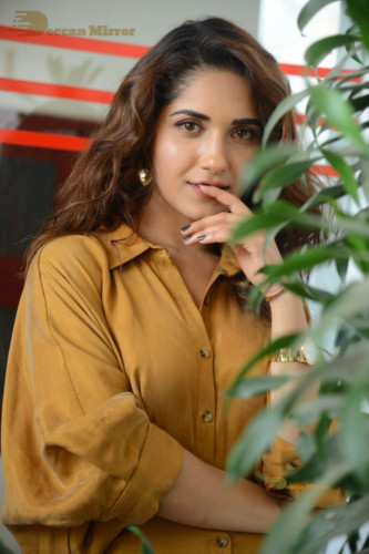 Telugu Actress Ruhani Sharma Photoshoot in a dark yellow dress