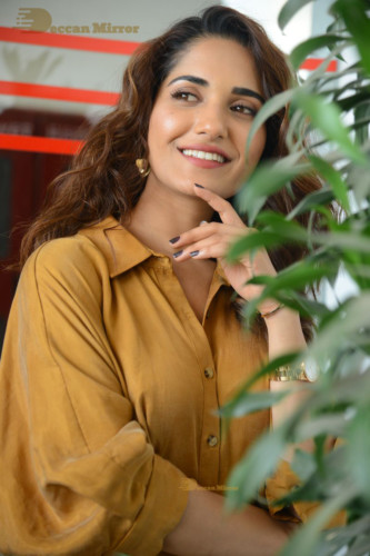 Telugu Actress Ruhani Sharma Photoshoot in a dark yellow dress