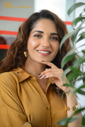 Telugu Actress Ruhani Sharma Photoshoot in a dark yellow dress