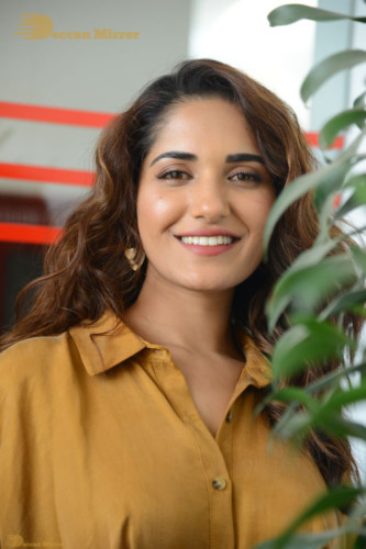 Telugu Actress Ruhani Sharma Photoshoot in a dark yellow dress