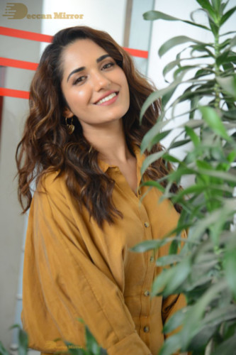 Telugu Actress Ruhani Sharma Photoshoot in a dark yellow dress