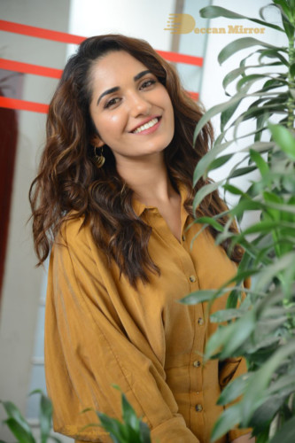 Telugu Actress Ruhani Sharma Photoshoot in a dark yellow dress