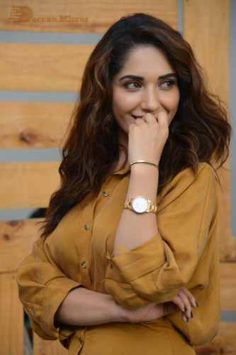 Telugu Actress Ruhani Sharma Photoshoot in a dark yellow dress