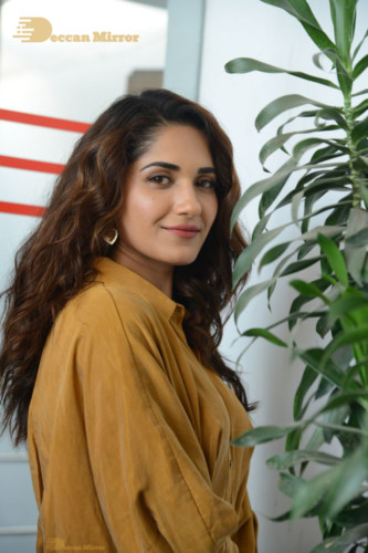 Telugu Actress Ruhani Sharma Photoshoot in a dark yellow dress