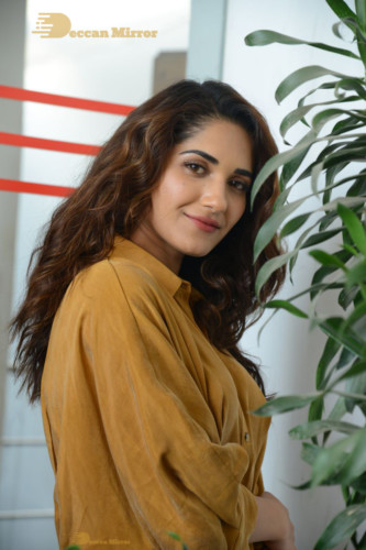 Telugu Actress Ruhani Sharma Photoshoot in a dark yellow dress