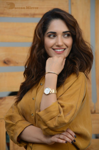 Telugu Actress Ruhani Sharma Photoshoot in a dark yellow dress