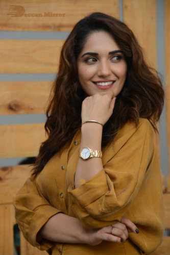 Telugu Actress Ruhani Sharma Photoshoot in a dark yellow dress