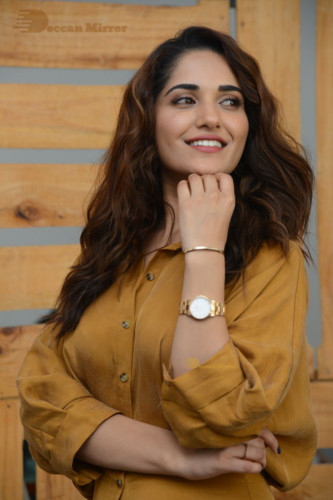 Telugu Actress Ruhani Sharma Photoshoot in a dark yellow dress
