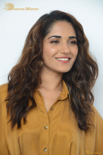 Telugu Actress Ruhani Sharma Photoshoot in a dark yellow dress