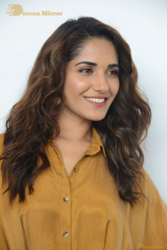 Telugu Actress Ruhani Sharma Photoshoot in a dark yellow dress