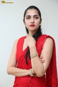 actress Rukmini Vasanth ravishing in a red saree