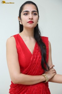 actress Rukmini Vasanth ravishing in a red saree