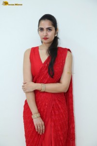 actress Rukmini Vasanth ravishing in a red saree