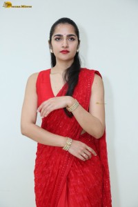actress Rukmini Vasanth ravishing in a red saree