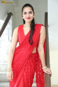 actress Rukmini Vasanth ravishing in a red saree