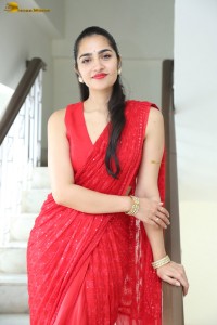 actress Rukmini Vasanth ravishing in a red saree
