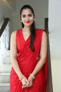 actress Rukmini Vasanth ravishing in a red saree