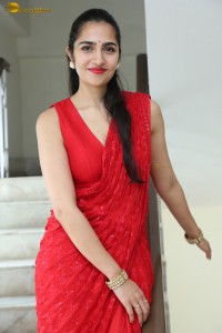 actress Rukmini Vasanth ravishing in a red saree