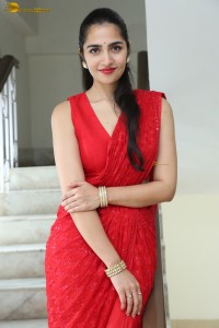 actress Rukmini Vasanth ravishing in a red saree