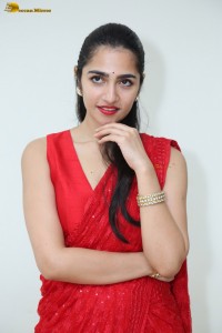 actress Rukmini Vasanth ravishing in a red saree