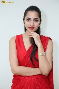 actress Rukmini Vasanth ravishing in a red saree