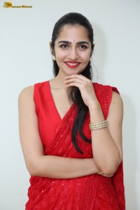 actress Rukmini Vasanth ravishing in a red saree