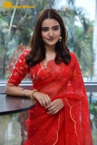 Actress Rukshar Dhillon in a Red Saree