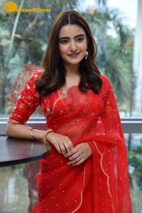Actress Rukshar Dhillon in a Red Saree