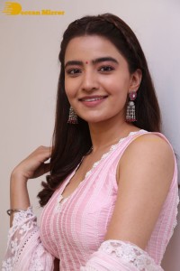 Actress Rukshar Dhillon in a pink dress