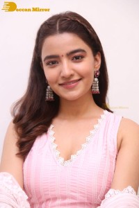 Actress Rukshar Dhillon in a pink dress