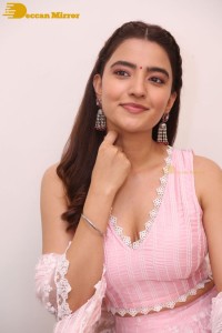 Actress Rukshar Dhillon in a pink dress