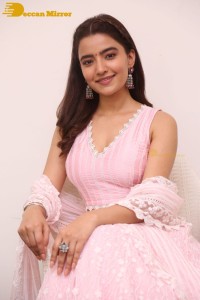 Actress Rukshar Dhillon in a pink dress