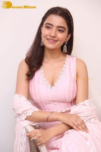 Actress Rukshar Dhillon in a pink dress