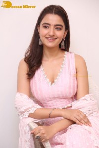 Actress Rukshar Dhillon in a pink dress