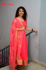 Model turned Actress Sai Keerthana Swargam in Red Salwar Kameez posing for a photoshoot