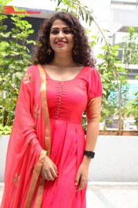 Model turned Actress Sai Keerthana Swargam in Red Salwar Kameez posing for a photoshoot