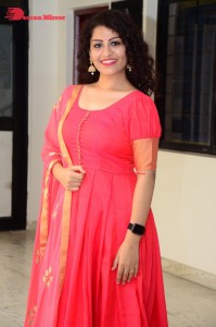 Model turned Actress Sai Keerthana Swargam in Red Salwar Kameez posing for a photoshoot
