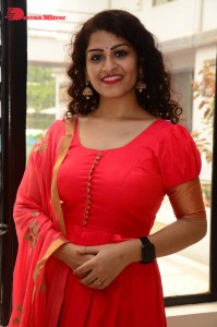 Model turned Actress Sai Keerthana Swargam in Red Salwar Kameez posing for a photoshoot