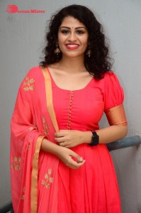 Model turned Actress Sai Keerthana Swargam in Red Salwar Kameez posing for a photoshoot