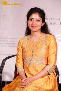 Actress Sai Pallavi in a yellow salwar kameez dress