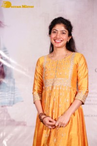 Actress Sai Pallavi in a yellow salwar kameez dress