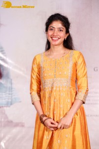 Actress Sai Pallavi in a yellow salwar kameez dress